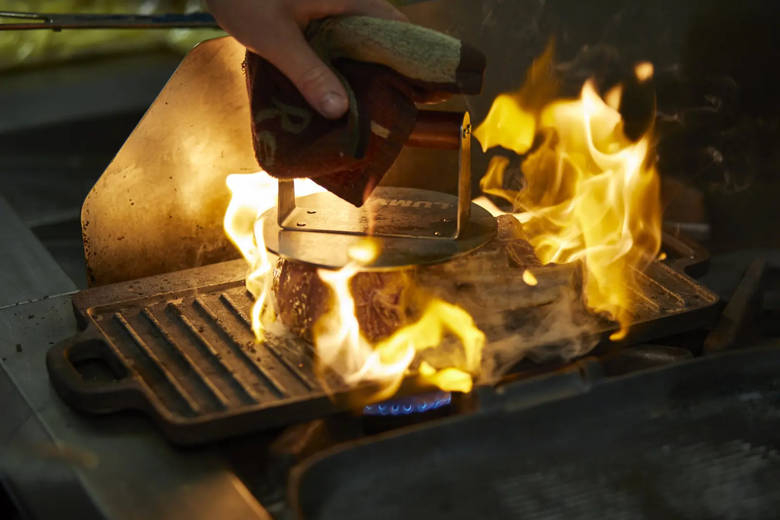 Flames leaping from the grill in the kitchen
